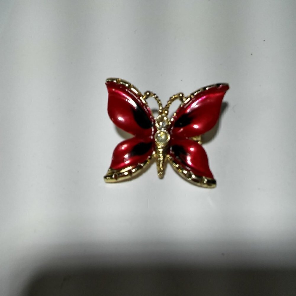 Women`s gold tone red butterfly brooch pin.